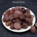 Natural strawberry crystal raw stone fragments displayed in a white ceramic dish - Strawberry Quartz