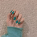 Glossy teal short square round press-on nails shown on hand with knitted sleeve detail - Glossy Teal Short Square Round Nails (Glue Style) (JP773)