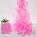 Pink spiral ceiling streamers for party decor with compact circular packaging - Pink