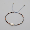 Bohemian handmade beaded bracelet with natural pearl and adjustable blue woven string cord - Multicolor