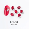 Macro shot of 9x7mm red heart nail rhinestone with silver micro-pave alloy setting - Red Heart (5761)
