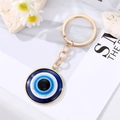 Golden alloy evil eye keychain with blue resin charm for bags and fashion accessories - 1 25MM Gold Eye