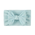 Detail of light blue jacquard nylon baby headband featuring a soft knit texture and bow - Blue