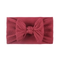 Detail of soft jacquard nylon baby headband with hollow knit texture and a large bow - Burgundy