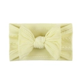 Detail of soft yellow jacquard nylon baby headband with textured cable knit bow - Beige