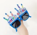 Blue birthday cake party glasses with rainbow candles and colorful Happy Birthday text - Blue Candle
