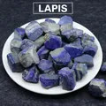 Natural raw lapis lazuli stones in deep blue displayed in a white decorative tray - Lapis Lazuli