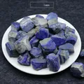 Natural raw lapis lazuli stones in deep blue displayed in a white decorative tray - Lapis Lazuli