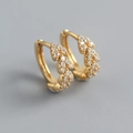 Macro detail of gold hoop earrings with leaf design and micro-pave cubic zirconia - 925 Silver / Gold