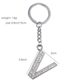Detail of silver letter V keychain with sparkling rhinestones and dimensions shown - Letter V