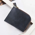 Slim dark grey faux leather L-zip wallet with globe logo on magazine background - Dark Blue