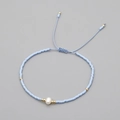 Light blue beaded bracelet with a white natural pearl and adjustable woven drawstring - Light Blue