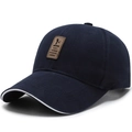 Gorra de béisbol azul marino para hombre en algodón con parche de cuero y ribete blanco - Ajustable / Azul marino con etiqueta marrón (borde blanco)