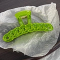 Detailed close-up of a large fluorescent green chain-link hair claw clip with acrylic texture - Green