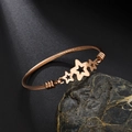 Rose gold steel wire cable bracelet featuring three hollow star charms in a sleek finish - Pentagram / Rose Gold