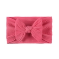 Detailed knit texture of soft nylon baby headband with a large pink jacquard bow - Rose Red