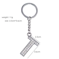 Detailed close-up of rhinestone letter T keychain with silver metal dimensions info - Letter T