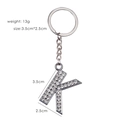 Silver letter K keychain with white rhinestones showing dimensions 3.5cm x 2.5cm and 13g weight - Letter K