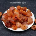 Southern red agate raw gemstone cluster with natural unpolished texture on white plate - Red Agate