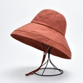 Rust red wide-brim sun hat with adjustable wind rope on black metal stand - M(56-58cm) / Rust Red (20I010)
