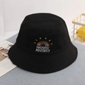 Detailed close-up of rainbow embroidery and text on a black cotton sun hat for kids - 52cm / Black