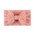 Pink soft jacquard nylon baby headband with knitted bow design on a white background - Pink