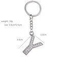 Detail of rhinestone letter Y keychain showing dimensions 3.5cm by 2.5cm and 10g weight - Letter Y