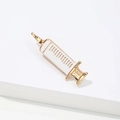 Enamel syringe lapel pin in gold and white finish for medical professionals - White Gold Syringe