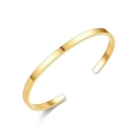 Detailed close-up of a sleek gold-finished stainless steel C-shaped open cuff bracelet - 4mm / Gold