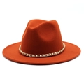 Close-up of elegant wide brim felt fedora with pearl and gold chain decoration - M (56-58cm) / Rust red