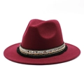Detail of burgundy fedora hat with ethnic style sequin band and black tassel trim - Burgundy