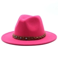 Detail of deep pink fedora hat featuring woven leather band with studs and blue beads - Rose Red