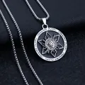 Macro shot of retro stainless steel pendant with silver star and mysterious runes - Enamel Star + Stainless Steel Chain