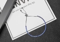 Silver adjustable rhinestone bracelet with dark blue crystals and sliding bead closure - Blue