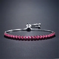 Adjustable silver chain bracelet featuring a row of vibrant pink round cut rhinestones - Red