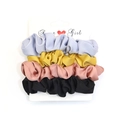 Set of 4 silk satin hair scrunchies in purple, yellow, pink, and black on a white card - RT-229-S (4-Piece Soft Satin Color Set)