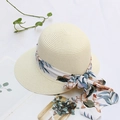 Detail of beige straw sun hat with floral chiffon ribbon and bow on a white background - Adjustable / Cream