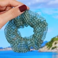 Detail of green checkered organza scrunchie with translucent pleated texture - Green Plaid