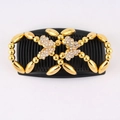 Close-up of golden butterfly beads and sparkling rhinestones on the magic hair comb - Butterfly - Gold