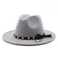 Close-up of grey fedora hat with black ribbon, elegant pearls and a bow detail - Light Gray