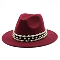 Macro shot of burgundy wool fedora hat featuring triple-row pearl embellishments on black band - Burgundy