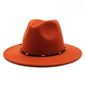 Detail of rust red wool fedora with a black decorative band and gold metal accents - M(56-58cm) / Rust red