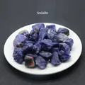 Natural raw Sodalite crystal stones with deep blue color and white veins in a white tray - Sodalite