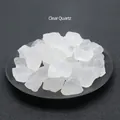 Natural clear quartz raw crystal stones displayed on a black decorative tray for decor - White Crystal