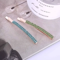 Close-up of blue and green rhinestone hair clips with rose gold plating - Lake Blue