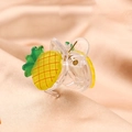 Macro view of a cute yellow pineapple hair claw clip for girls on pink fabric - Pineapple Claw Clip