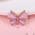 Macro view of a 29mm purple rhinestone butterfly charm accessory with golden base - D461 Translucent Butterfly (Purple)