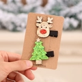 Set de pinzas navideñas brillantes con reno y árbol en una tarjeta de kraft - Diseño de Reno