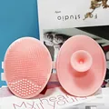 Soft pink silicone facial cleansing brush with dual-texture bristles and suction handle - Sakura Pink
