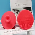 Set of two rose red silicone facial cleansing brushes with suction cup handles - Coral